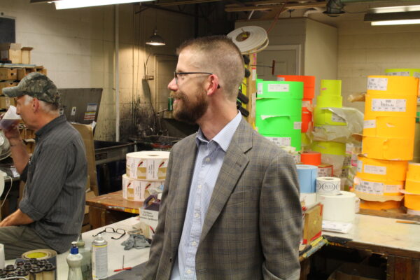 Mike Goldade showed the operation of the presses while Andrew Latham greeted guests